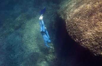 Free Diver Underwater Rocks